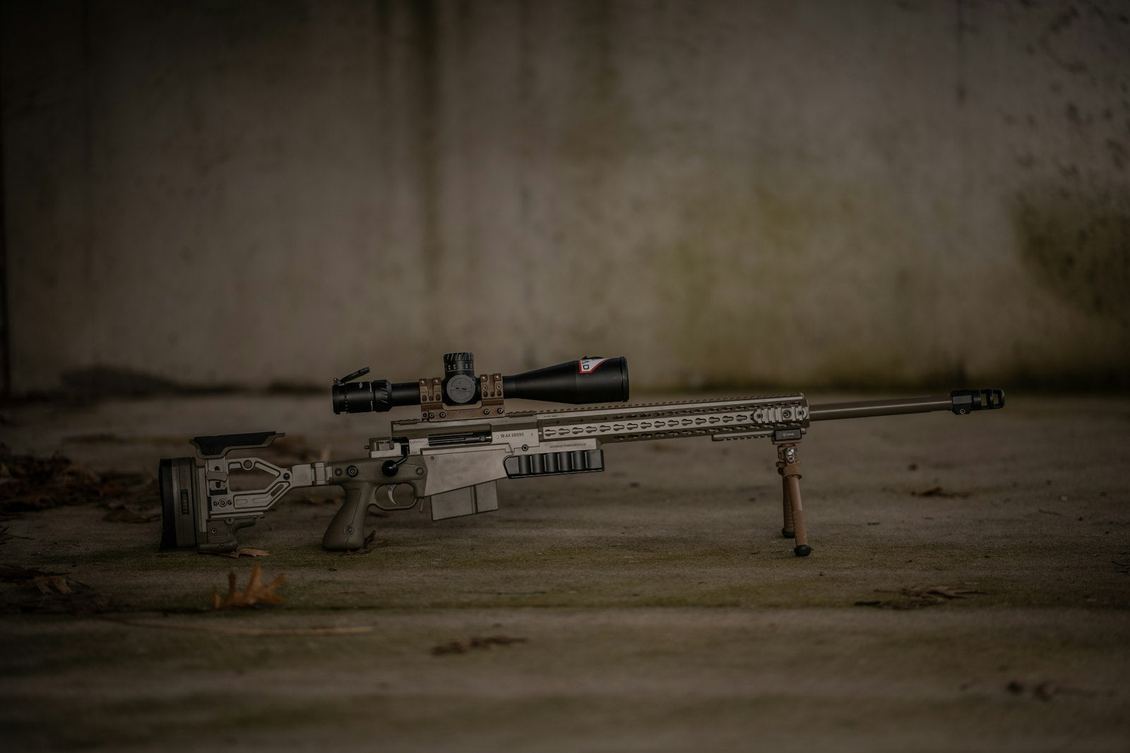 Bolt-action rifle with a mounted optical scope on a bipod, the kind of hunting optic that fogs in cold, humid air without anti-fog treatment.